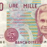 Moneta da 5 Lire del delfino, vista frontale, evidenziando dettagli e anno di emissione.